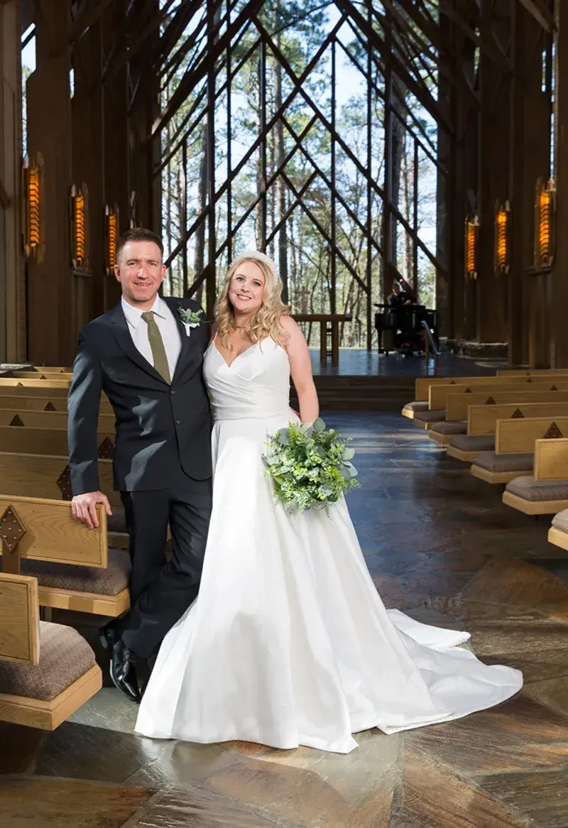 Wedding couple portrait outside the Anthony Chapel glass walls at Garvan Woodland Gardens