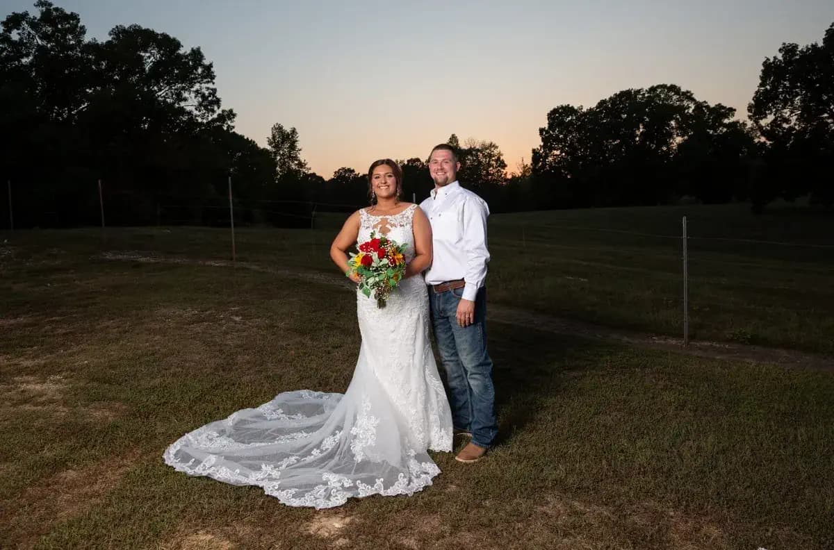 Bride and groom in the open fields at Cedar Hill Farm, Benton, Arkansas
