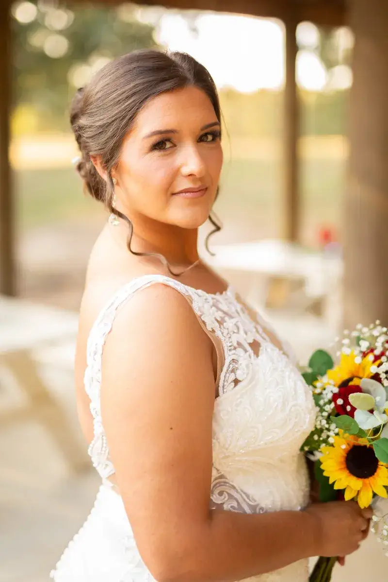 Close-up wedding portrait with Cedar Hill Farm's barn in the background