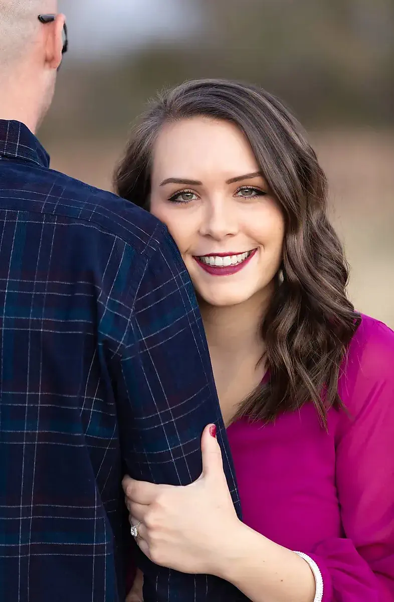 Woman resting her head on her partner's shoulder