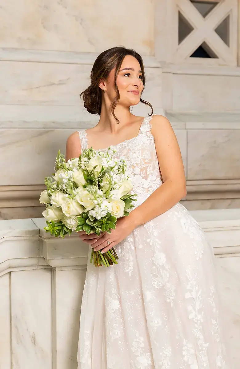 Bride portrait with a white rose bouquet