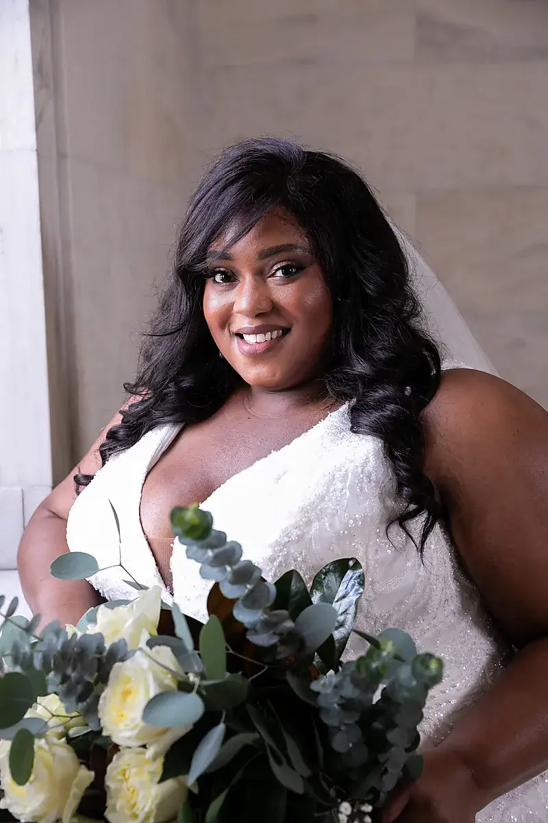 Bride portrait with a bouquet of white roses