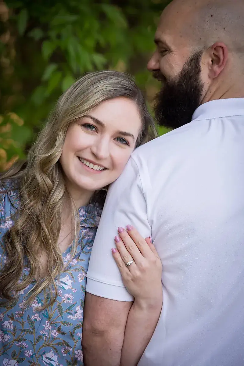 Woman leaning on her partner's shoulder during a Little Rock engagement session